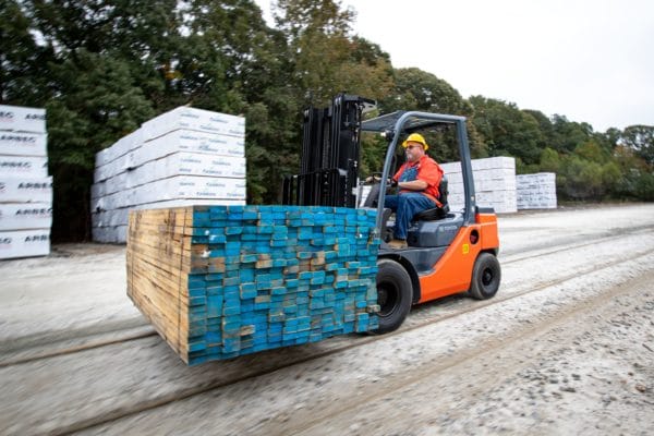 toyota pneumatic forklift carrying load of lumber